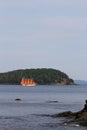 Vertical shot of a boat sailing on Frenchman Bay at Agamont Park, Bar Harbor in Maine, USA Royalty Free Stock Photo