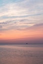 Vertical shot of a boat sailing in Lake Michigan at sunset Royalty Free Stock Photo