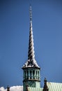 Vertical shot of the Borsen Copenhagen tower with a blue sky in the background in Denmark Royalty Free Stock Photo