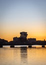 Vertical shot of Boston University's newest building on the coast at sunset