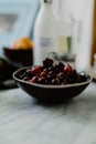 Vertical shot of a bowl of cherries in th Royalty Free Stock Photo