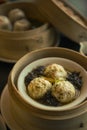 Vertical shot of a bowl of dumplings and vegetables