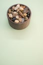 Vertical shot of a bowl filled with rocks and pebbles Royalty Free Stock Photo