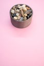 Vertical shot of a bowl filled with rocks and pebbles Royalty Free Stock Photo