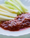 Vertical shot of breakfast with sliced cheese paprika and homemade Ajvar chutney