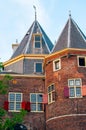 Vertical shot of brick buildings on the streets of Amsterdam, Netherlands. Royalty Free Stock Photo