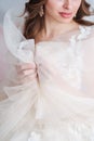 Vertical shot with bride`s hands in focus. Wedding concepts, details, ideas and themes, bride morning