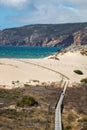 Vertical shot of a bridge leading to Playa del Guincho, Cascais, Portugal Royalty Free Stock Photo