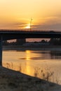 Vertical shot of a bridge in Novi Sad over the Danube river at sunset in Serbia Royalty Free Stock Photo