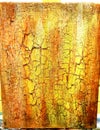 Vertical shot of bright yellow cracked painting texture