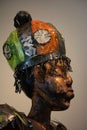 Vertical shot of a bronze statue head of an African Traditional religious belief