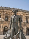 Vertical shot of the Bronze statue of matador Bull Fighter Nimeno II in Nimes, France Royalty Free Stock Photo