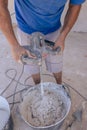 Vertical shot of a builder preparing the cement