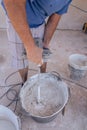 Vertical shot of a builder preparing the cement