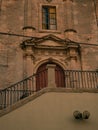 Vertical shot of a building with stairs in the Sicilian baroque town of Noto, Siracusa