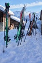 Vertical shot of a bunch of skis in the snow in the Swiss Alps. Royalty Free Stock Photo