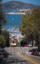 Vertical shot of a Cable Car in San Francisco with Alcatraz in Background Royalty Free Stock Photo