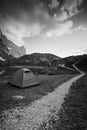 Vertical shot of a camp tent by a lake in the Lago Rienza, Italy, Europe