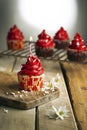 Vertical shot of a candle cupcake with red cream Royalty Free Stock Photo
