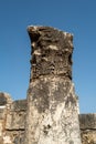 Vertical shot of Capernaum synagogue ornamented column with a blue sky in the background, Israel Royalty Free Stock Photo