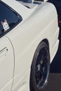 Vertical shot of a car with a sailor moon sticker on the window