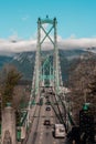 Vertical shot of cars on the Lions Gate Suspension Bridge in Vancouver, Canada Royalty Free Stock Photo