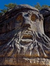 Vertical shot of the carved Devil\'s heads in Melnik, Czech Republic