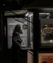 Vertical shot of a Caucasian male buying popcorn on the streets of Belgrade.