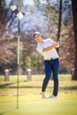 Vertical shot of a Caucasian male golfer playing a chip shot on a golf course Royalty Free Stock Photo