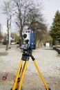 Vertical shot of  cheap geodesy level device on road Royalty Free Stock Photo