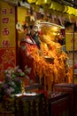 Vertical shot of Chinese idols in a market