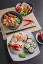 Vertical shot chinese and vietnamese cuisine set. Various of asian assorted dishes on gray background Royalty Free Stock Photo