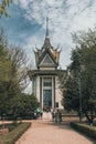 Vertical shot of a Choeung Ek Genocidal Center against a blue sky Royalty Free Stock Photo