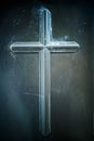 Vertical shot of a Christian cross on a dark damaged wall texture Royalty Free Stock Photo