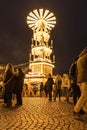Vertical shot of a Christmas pyramid in Rossmarkt Christmas market at night, Frankfurt, Germany
