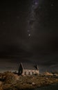 Vertical shot of the Church of the Good Shepherd on a hill under a breathtaking starry sky