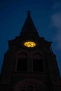 Vertical shot of a church's clock tower at night Royalty Free Stock Photo