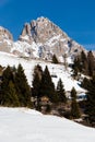 Vertical shot of the Cima Uomo Mountain in the Dolomites with ski lift and log cabin