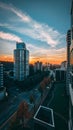 Vertical shot of the city of Vancouver with a beautiful sunset visible in the background