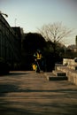 Vertical shot of a city worker picking garbage at West Bund in Shanghai, China