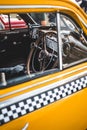 Vertical shot of a classic American yellow cab taxi interior