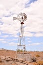 Vertical shot of a classic windmill on a cloudy day background