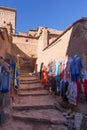 Vertical shot of clothes store in an alley of Ait Ben Haddou kasbah, Morocco Royalty Free Stock Photo