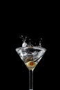 Vertical shot of a cocktail splash isolated on the black background Royalty Free Stock Photo