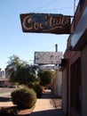 Vertical shot of a cocktails sign on the building