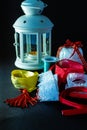 Vertical shot of a collection of decorative ribbons for wrapping and a candle holder