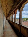 Vertical shot of a colonnaded corridor of Brihadishvara Temple overlooking a beautiful cityscape