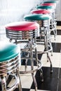 Vertical shot of colored stools at a classic American 1950s style diner in Tennessee