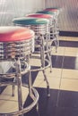 Vertical shot of colored stools at a classic American 1950s style diner in Tennessee