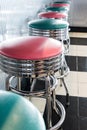 Vertical shot of colored stools at a classic American 1950s style diner in Tennessee